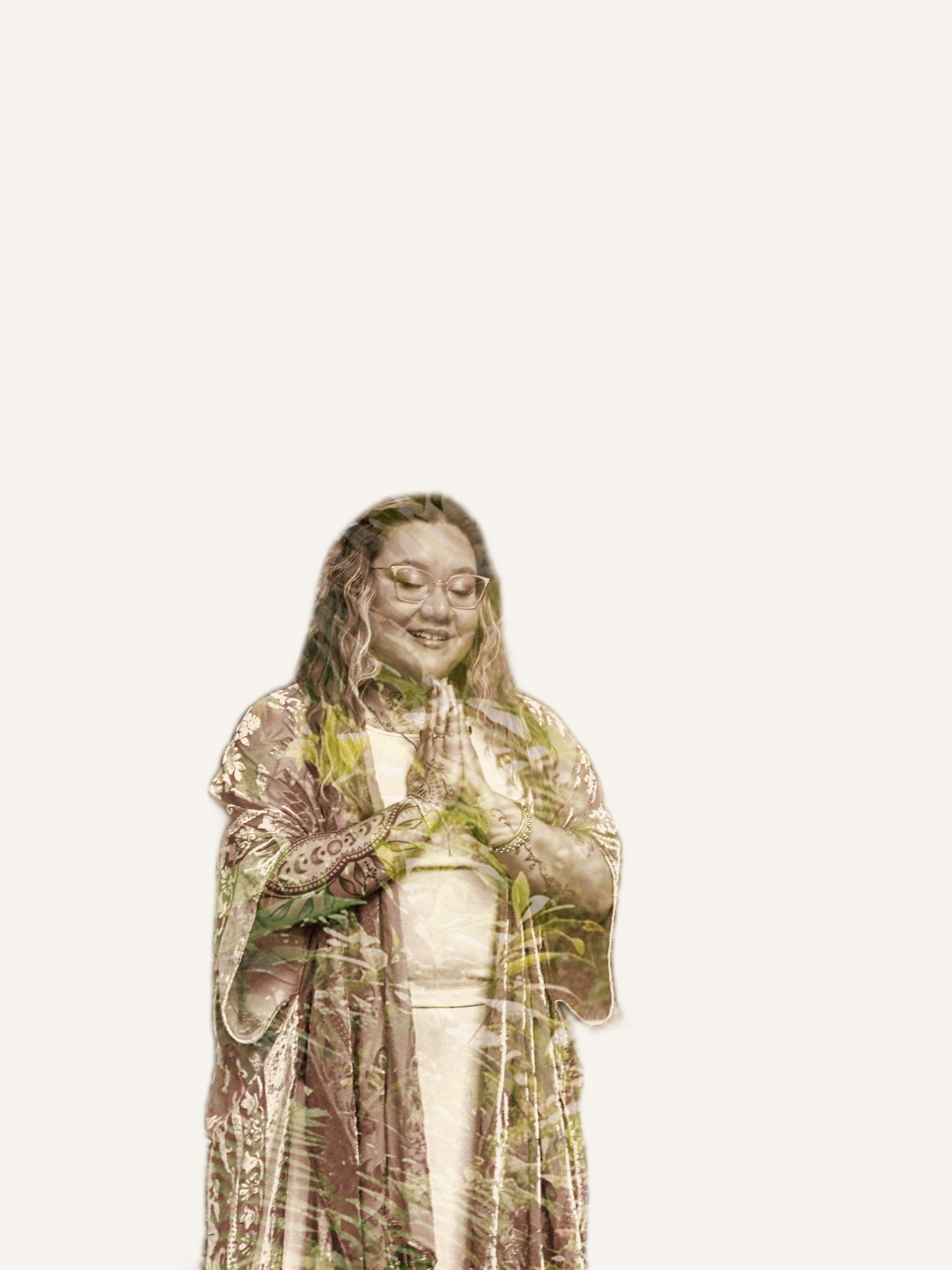 A double-exposure portrait of Xsana Saphire, eyes closed in prayer — Panama jungle leaves growing through her form